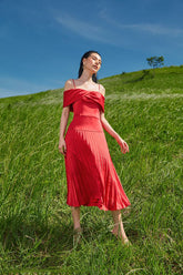 Silk off-shoulder midi dress with pleated skirt and structured bodice for elegant occasions